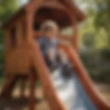 Child engaging in physical activity on a slide attached to a plastic playhouse