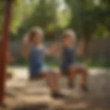 Children enjoying the thrill of swinging on a swing set