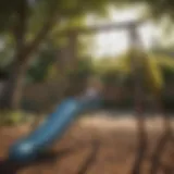 Children playing on small swing set with slide in backyard