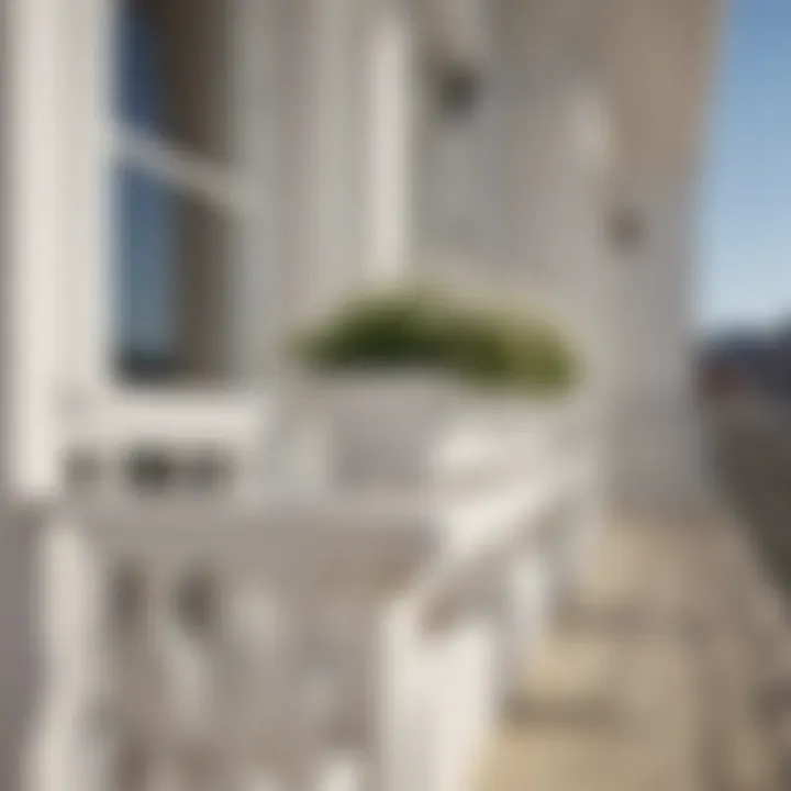 White wooden flower box hanging gracefully on a balcony railing