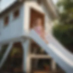 Children enjoying a white wooden slide in a playhouse